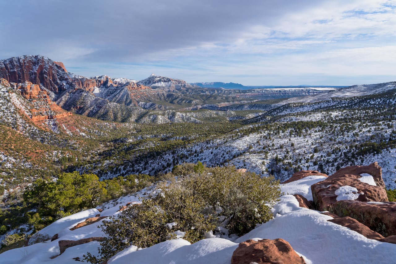 Scenic view of snow-covered Kolob Canyons, Zion National Park, Utah, under clear skies.