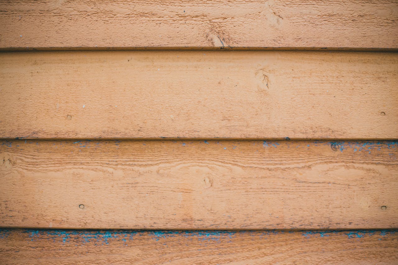Crafting Captivating Headlines: Your awesome post title goes here Close-up of a weathered wooden plank wall with rustic texture and natural patterns.